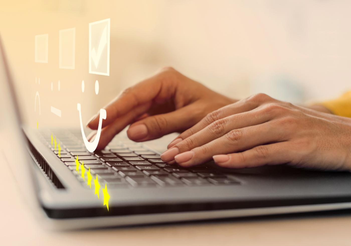 Hands typing on a laptop with floating icons for customer satisfaction.
